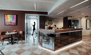 Receptionist helping clients at the front desk