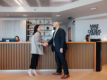 Reception at Servcorp Bastion Tower, Leopold Quarter—welcoming workspace with professional staff and modern design in Brussels